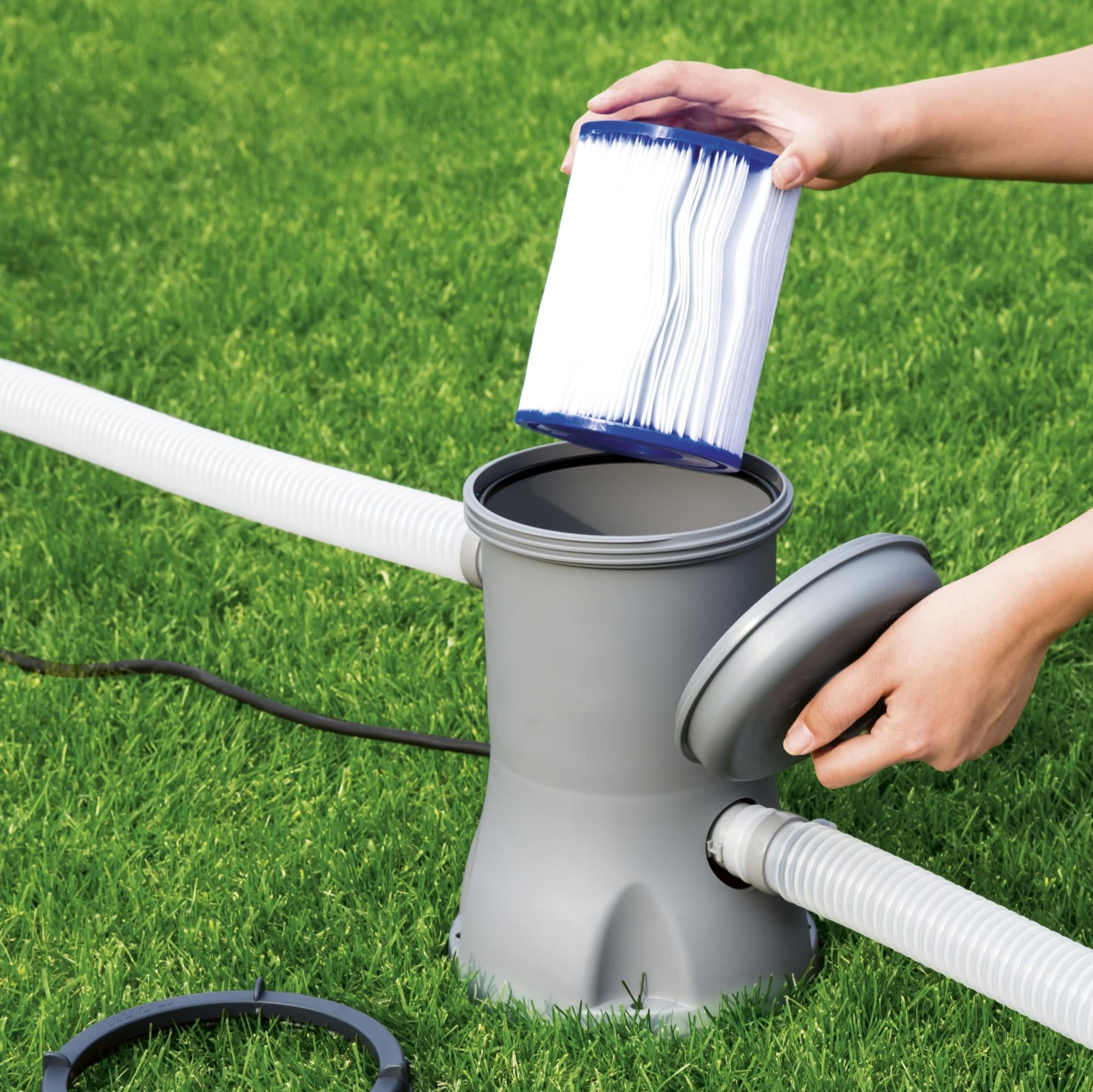 Pool filter cartridge being inserted into a Bestway pool filter pump